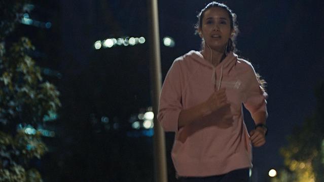 Woman jogging at night